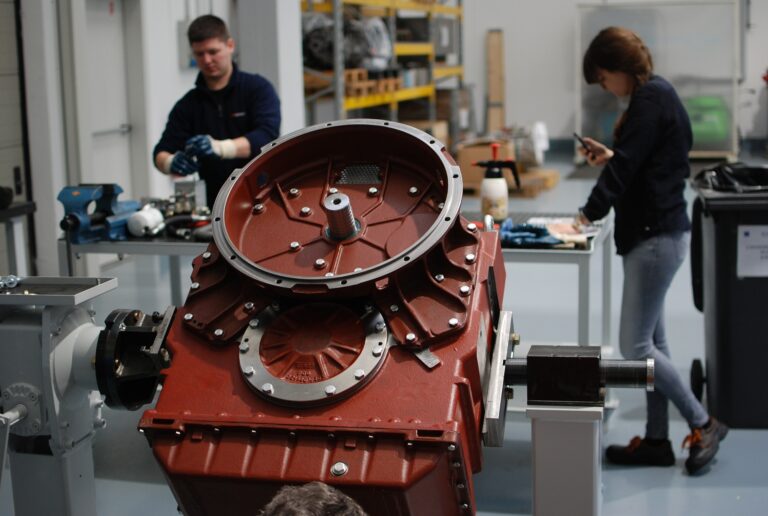 Closeup of a marine powertrain component in a workshop.